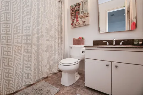 a bathroom with a toilet and a sink