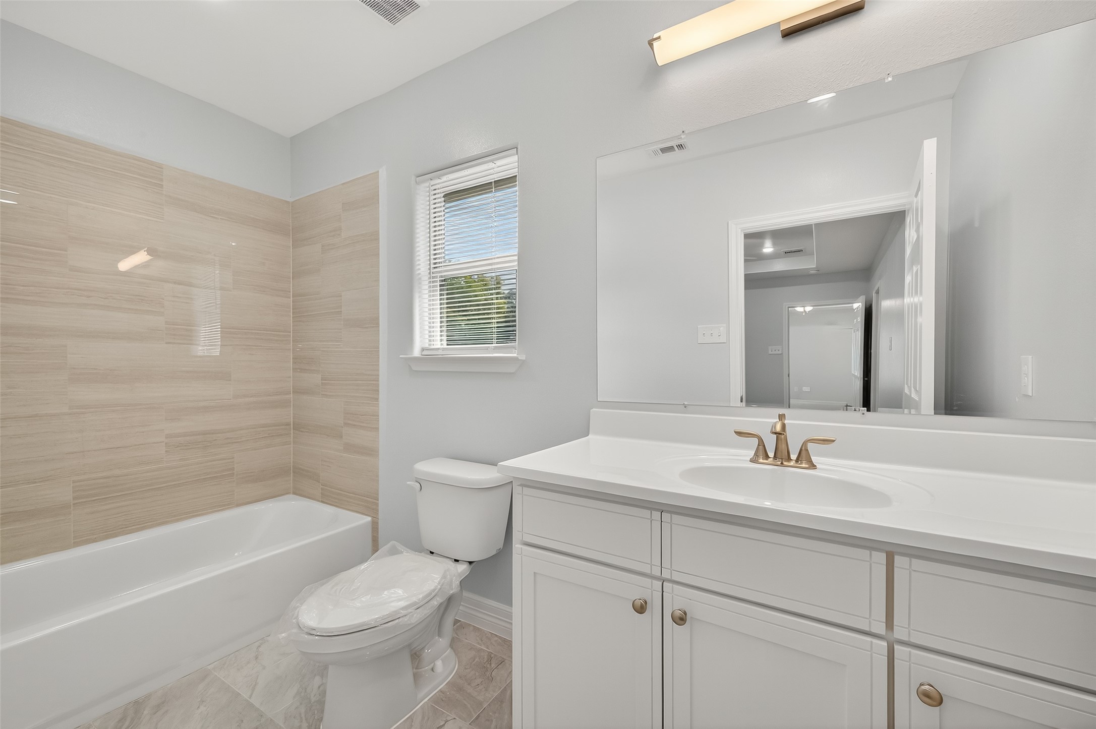 6928 Apache Street Houston, TX 77028 - Photo 25 of 40 a bathroom with a sink toilet tub and shower