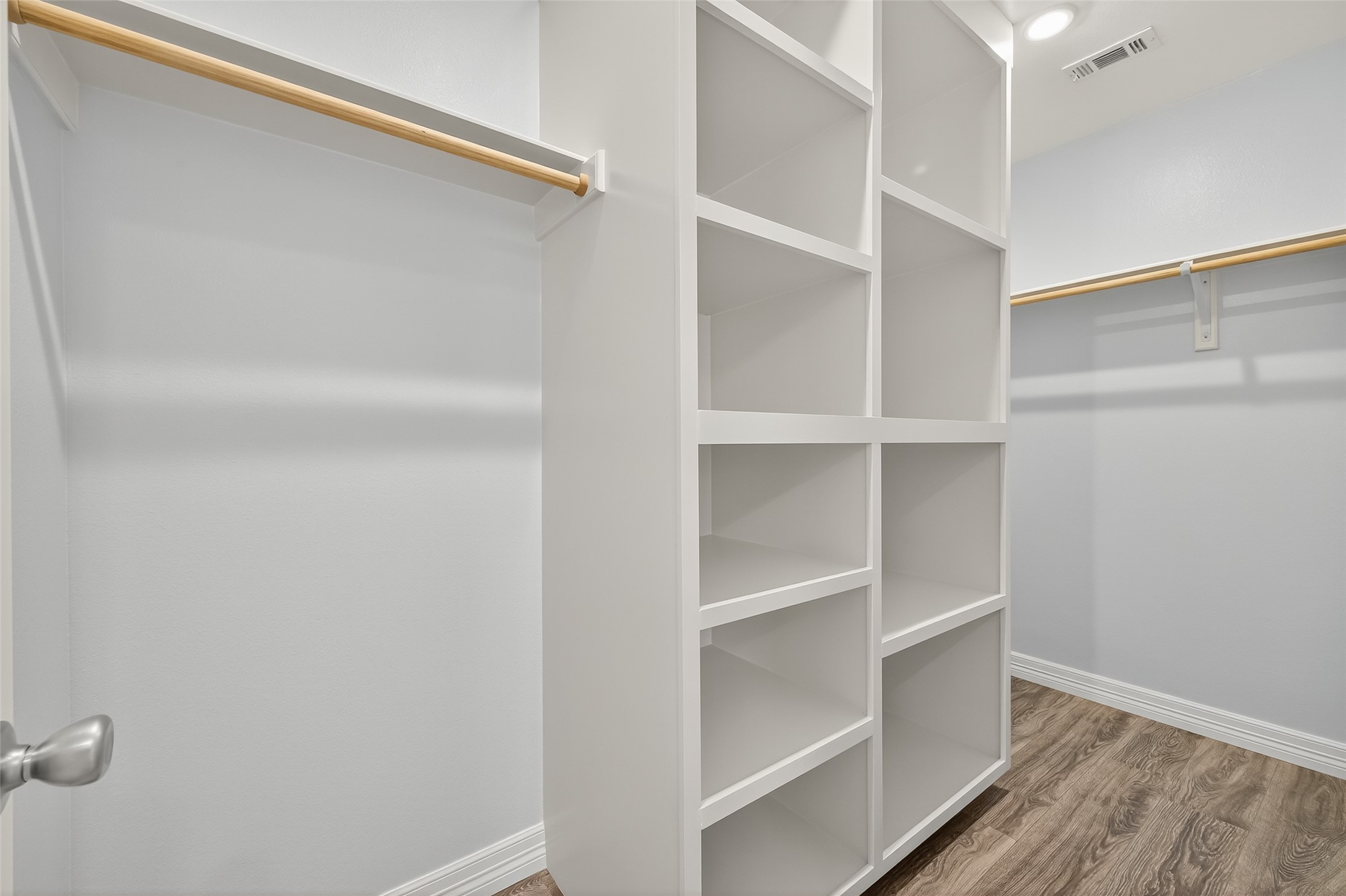 6928 Apache Street Houston, TX 77028 - Photo 26 of 40 a view of walk in closet with empty racks
