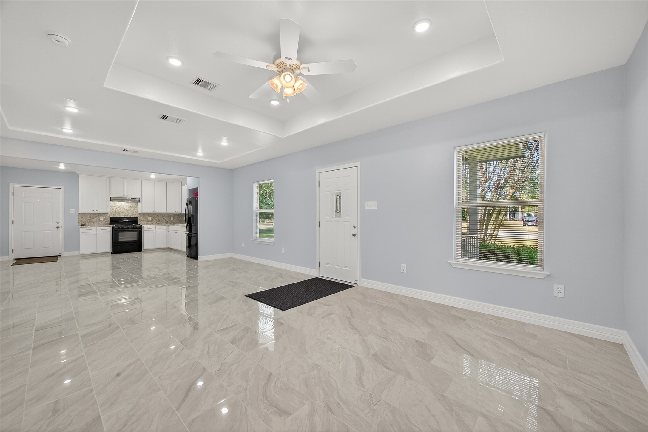 6928 Apache Street Houston, TX 77028 - Photo 8 of 40 a view of an empty room with window and cabinet