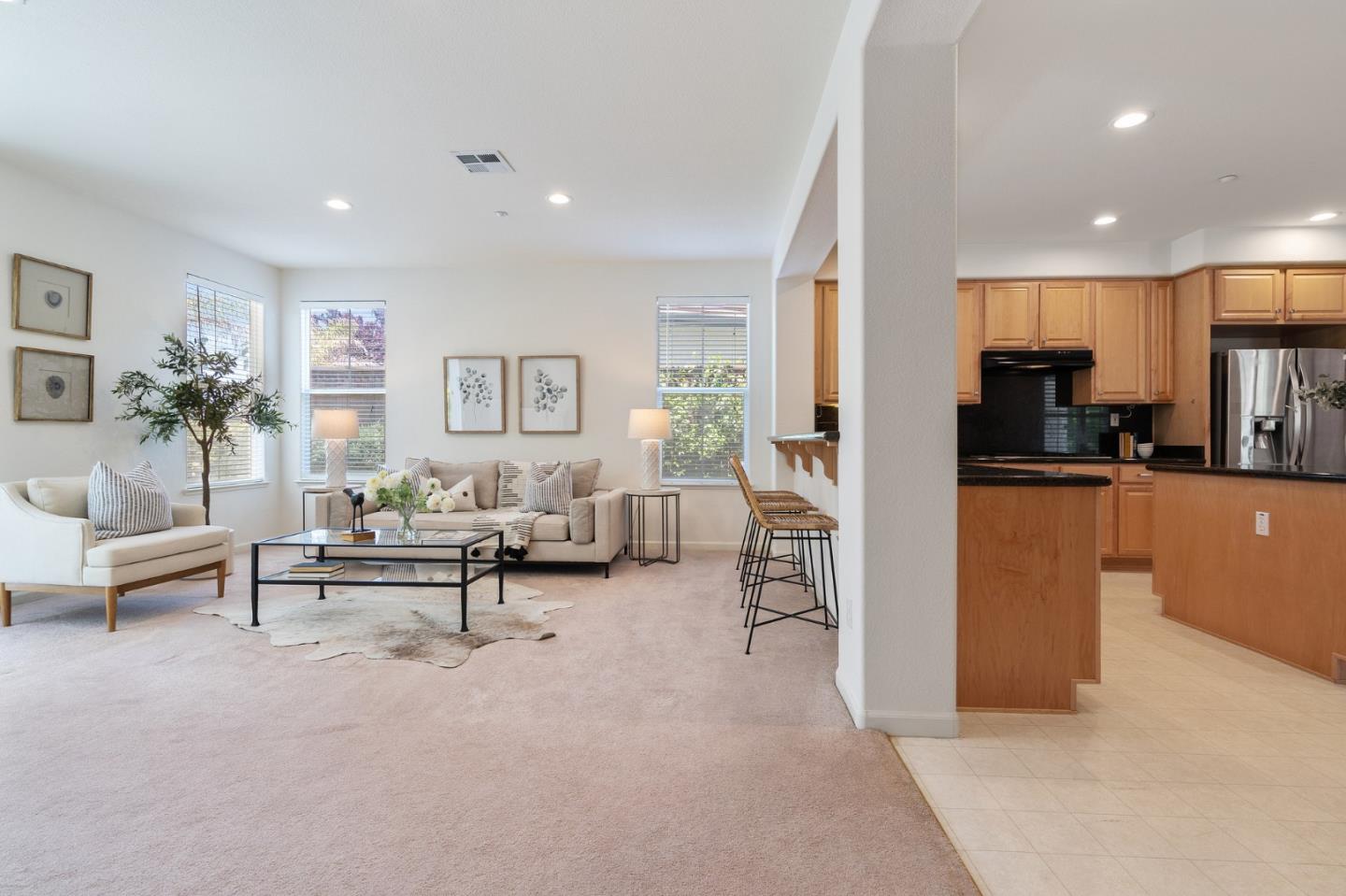 357 Pebble Beach Drive Brentwood, CA 94513 - Photo 13 of 56 a living room with furniture and a dining table with kitchen view