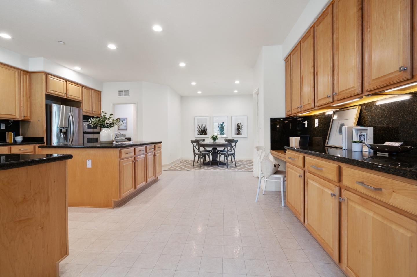 357 Pebble Beach Drive Brentwood, CA 94513 - Photo 18 of 56 a kitchen with stainless steel appliances kitchen island granite countertop a sink and cabinets