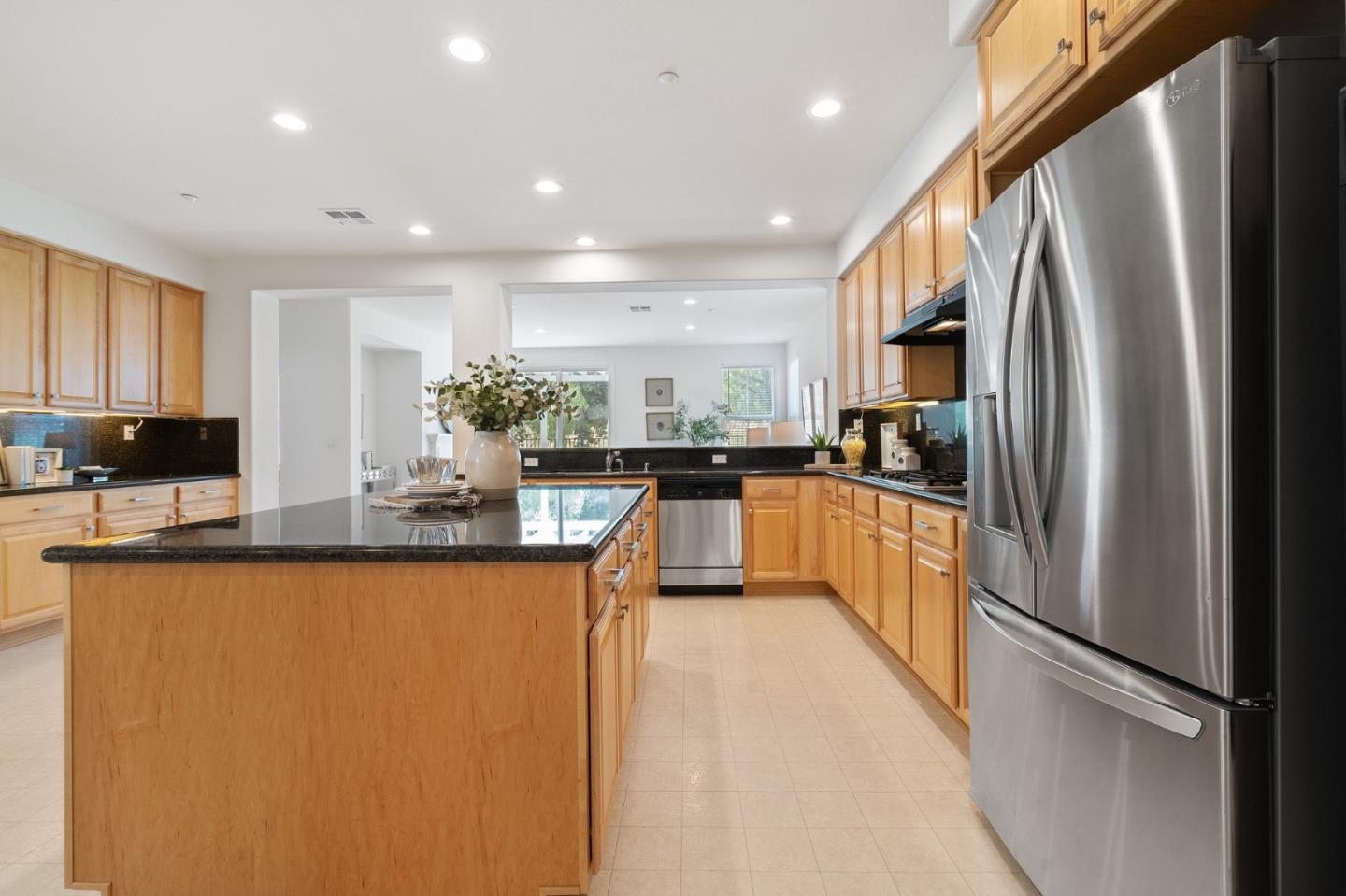 357 Pebble Beach Drive Brentwood, CA 94513 - Photo 22 of 56 a kitchen with stainless steel appliances granite countertop a refrigerator a sink a stove and a refrigerator