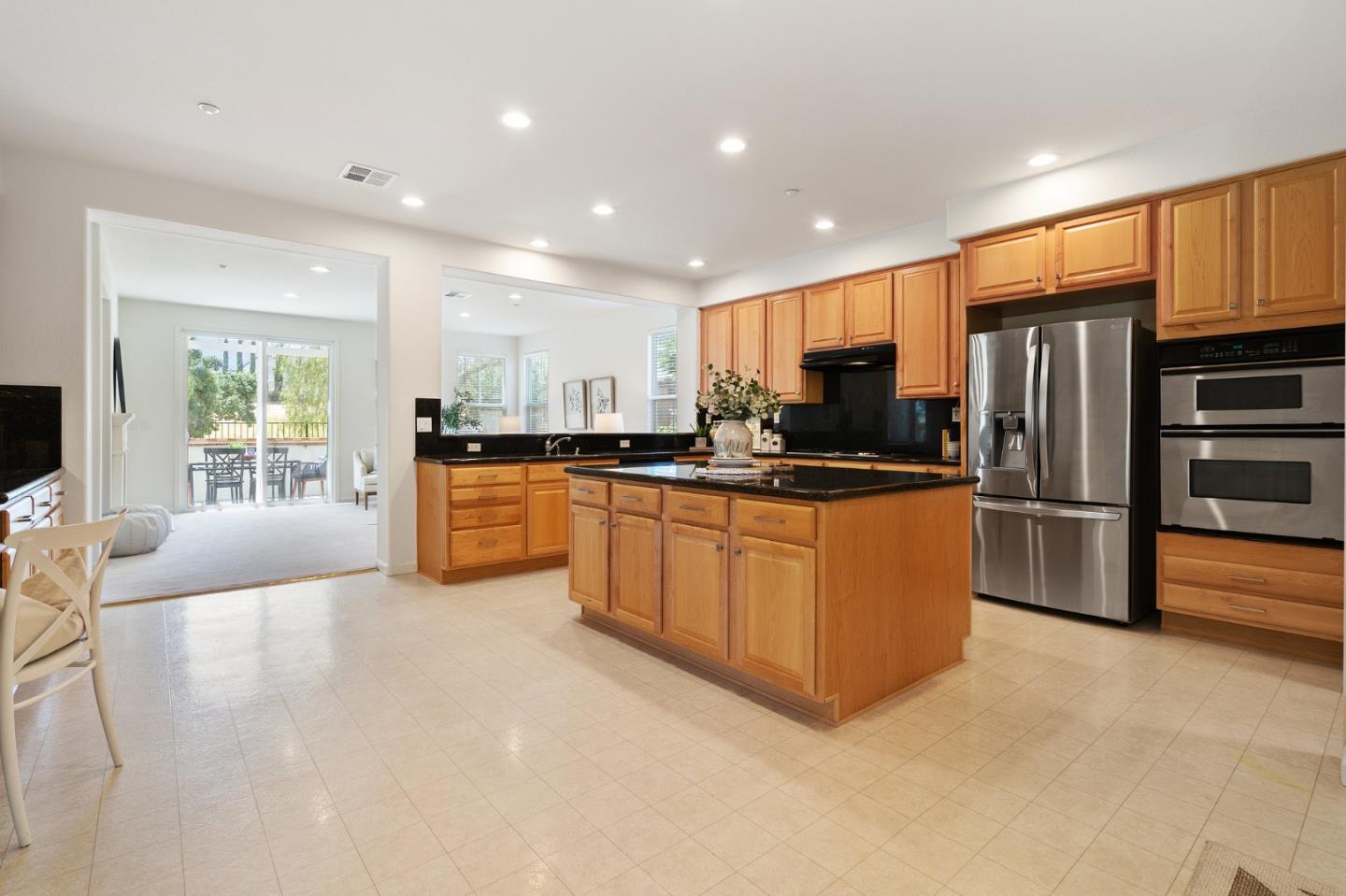 357 Pebble Beach Drive Brentwood, CA 94513 - Photo 23 of 56 a kitchen with stainless steel appliances a refrigerator a sink a stove top oven and cabinets