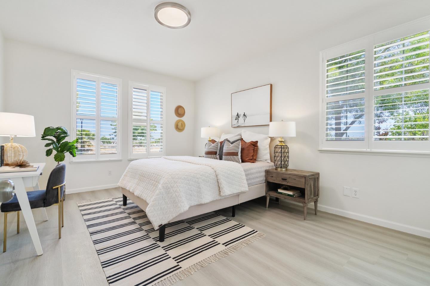 357 Pebble Beach Drive Brentwood, CA 94513 - Photo 28 of 56 a bedroom with a bed wooden floor and a table