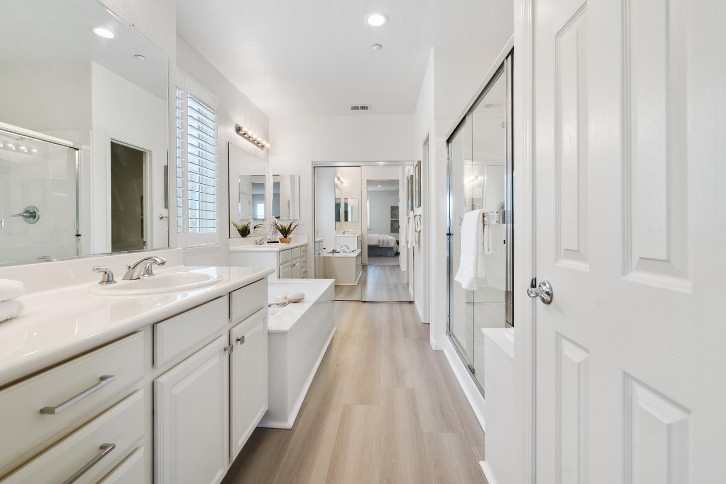 357 Pebble Beach Drive Brentwood, CA 94513 - Photo 38 of 56 a spacious bathroom with a double vanity sink and mirror