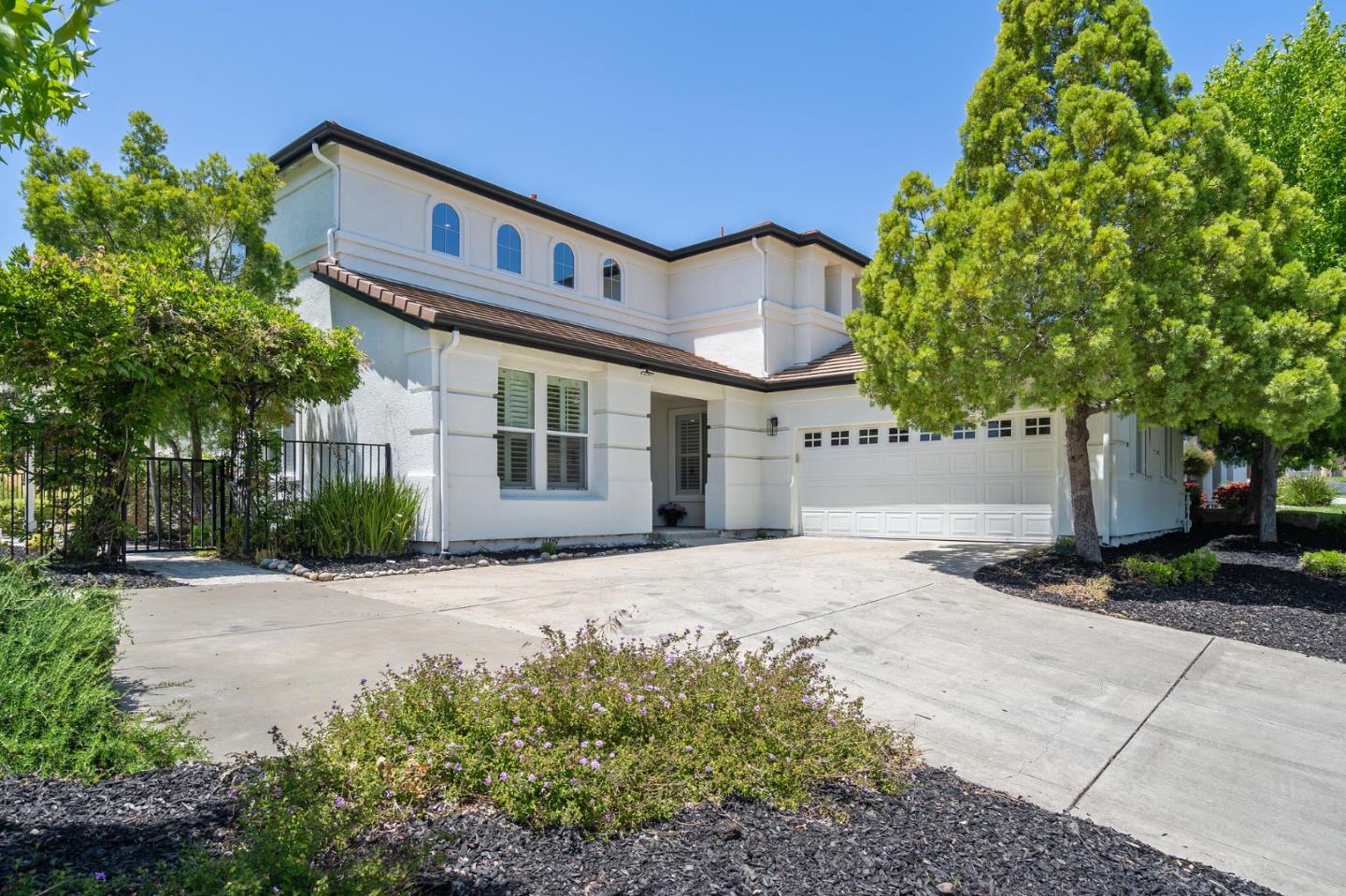 357 Pebble Beach Drive Brentwood, CA 94513 - Photo 4 of 56 a front view of a house with a yard and a garage