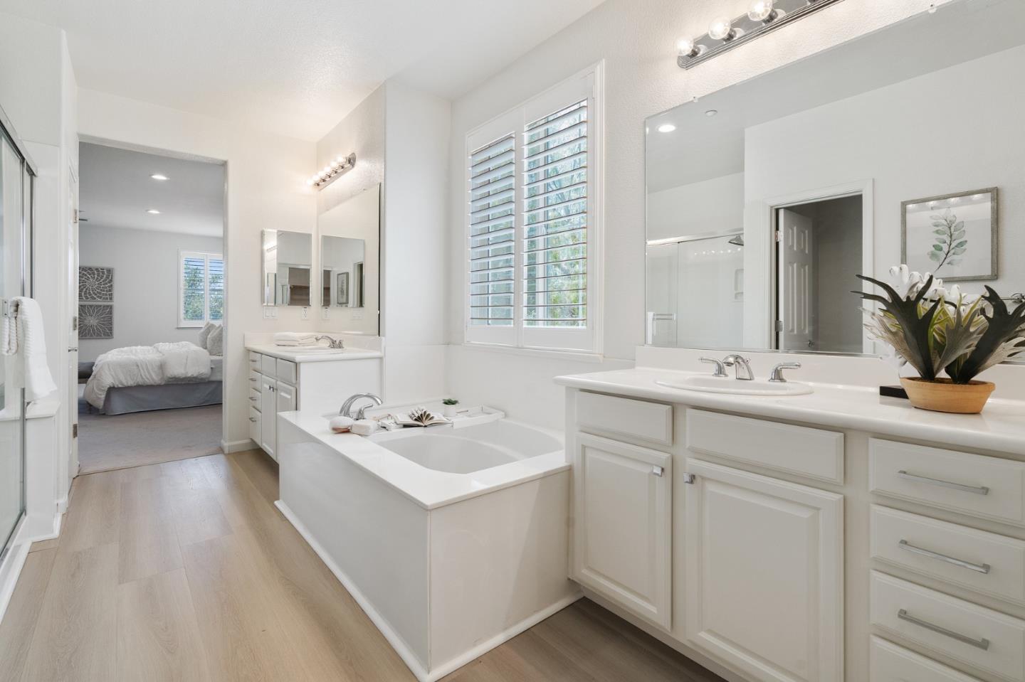 357 Pebble Beach Drive Brentwood, CA 94513 - Photo 41 of 56 a spacious bathroom with a double vanity sink a mirror and a bathtub