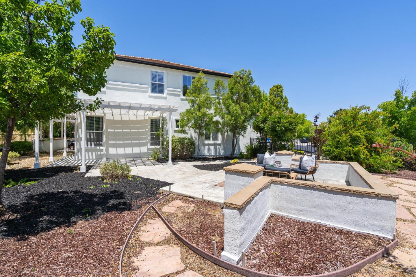 357 Pebble Beach Drive Brentwood, CA 94513 - Photo 51 of 56 a view of a backyard with plants and a patio