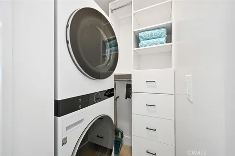 a bed room with a bed and a ceiling fan