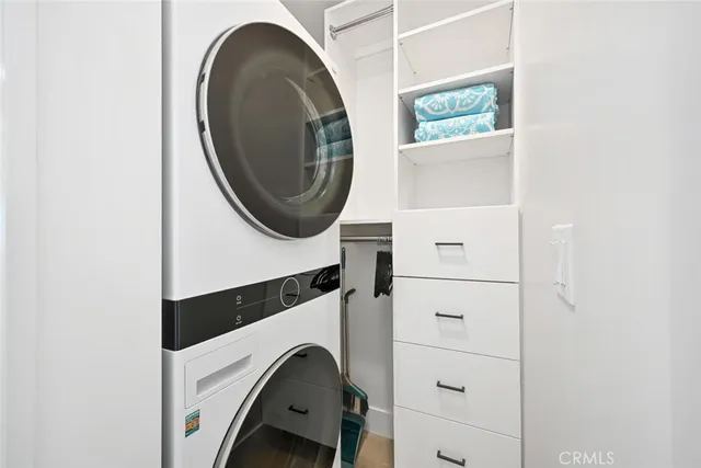 a bed room with a bed and a ceiling fan