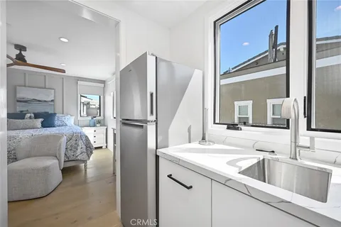 a spacious bedroom with a bed and window