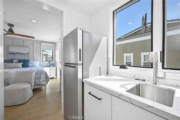 a spacious bedroom with a bed and window