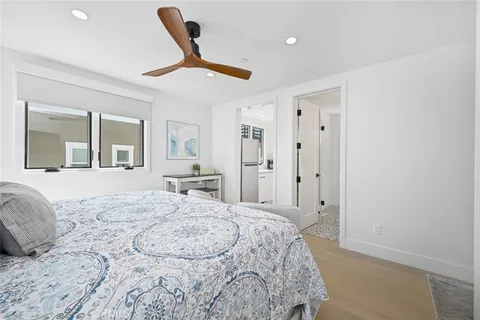 a bedroom with a large bed and a dresser