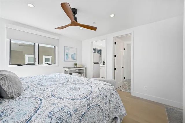 a bedroom with a large bed and a dresser