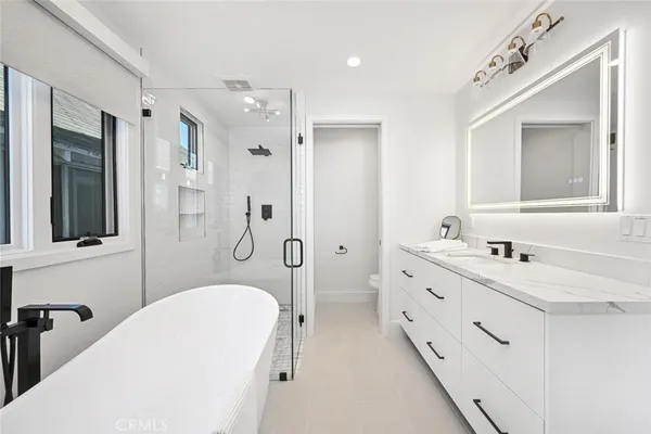 a bed room with furniture and wooden floor