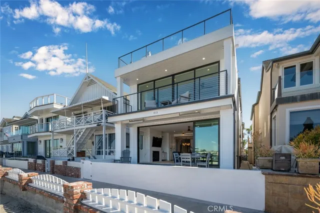 a dining room with furniture and view of kitchen
