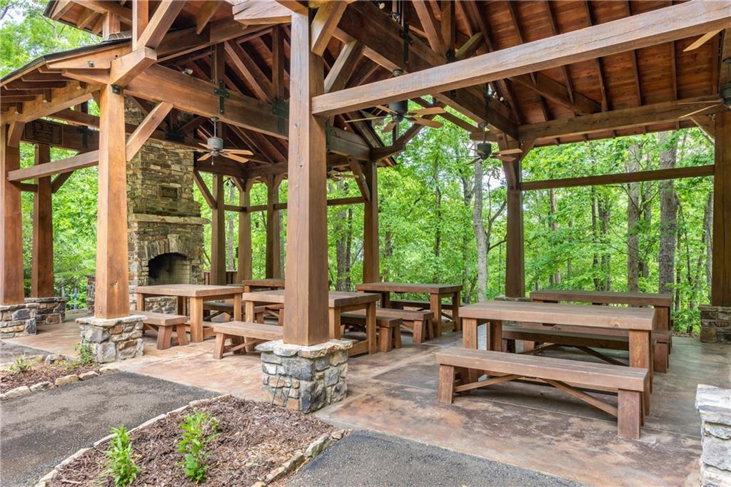 206 R Mystic Trail Lane Jasper, GA 30143 - Photo 32 of 38 a building outdoor space with patio furniture and potted plants