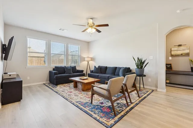 a living room with furniture and a window