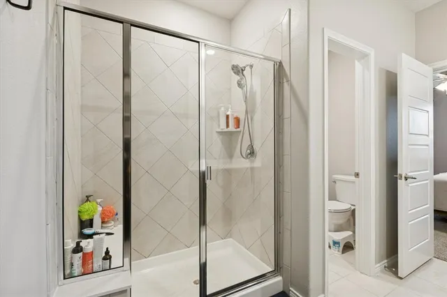 a bathroom with a shower and a sink