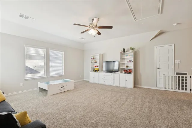 a living room with furniture and window