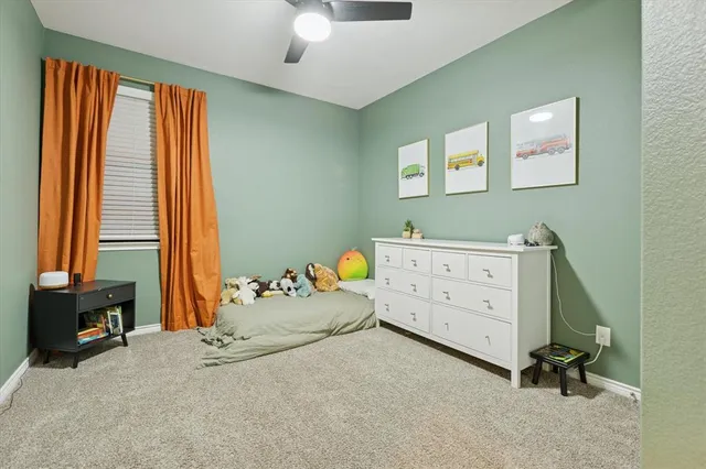 a bedroom with a workspace