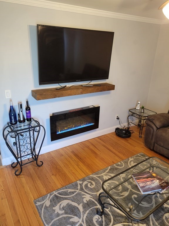 591 Chicago Street Fall River, MA 02721 - Photo 10 of 26 a bedroom with a bed and chair