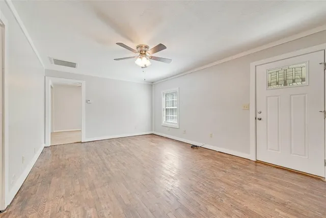 a kitchen with granite countertop white cabinets and stainless steel appliances