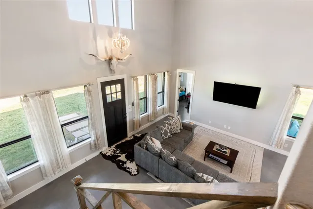 a view of a patio with table and chairs and potted plants
