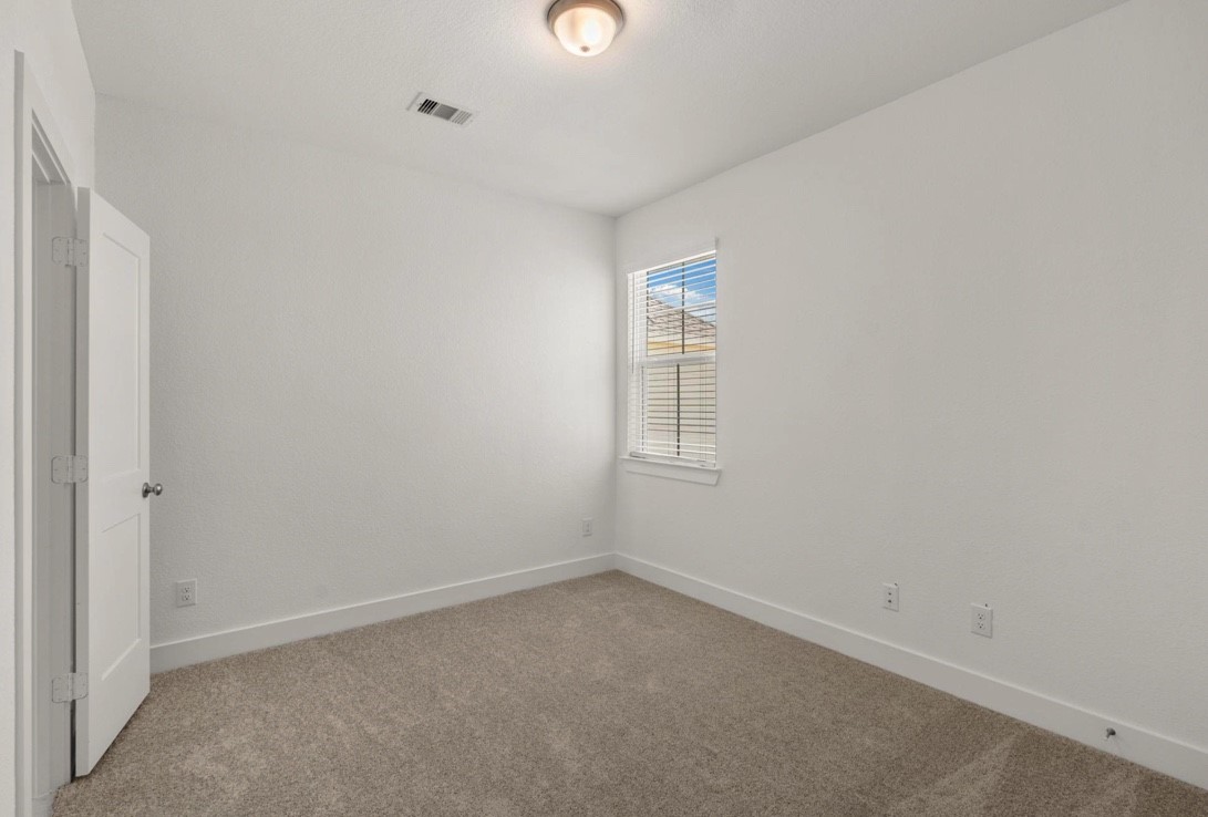 5234 Capricorn Way Manvel, TX 77578 - Photo 16 of 25 an empty room with windows