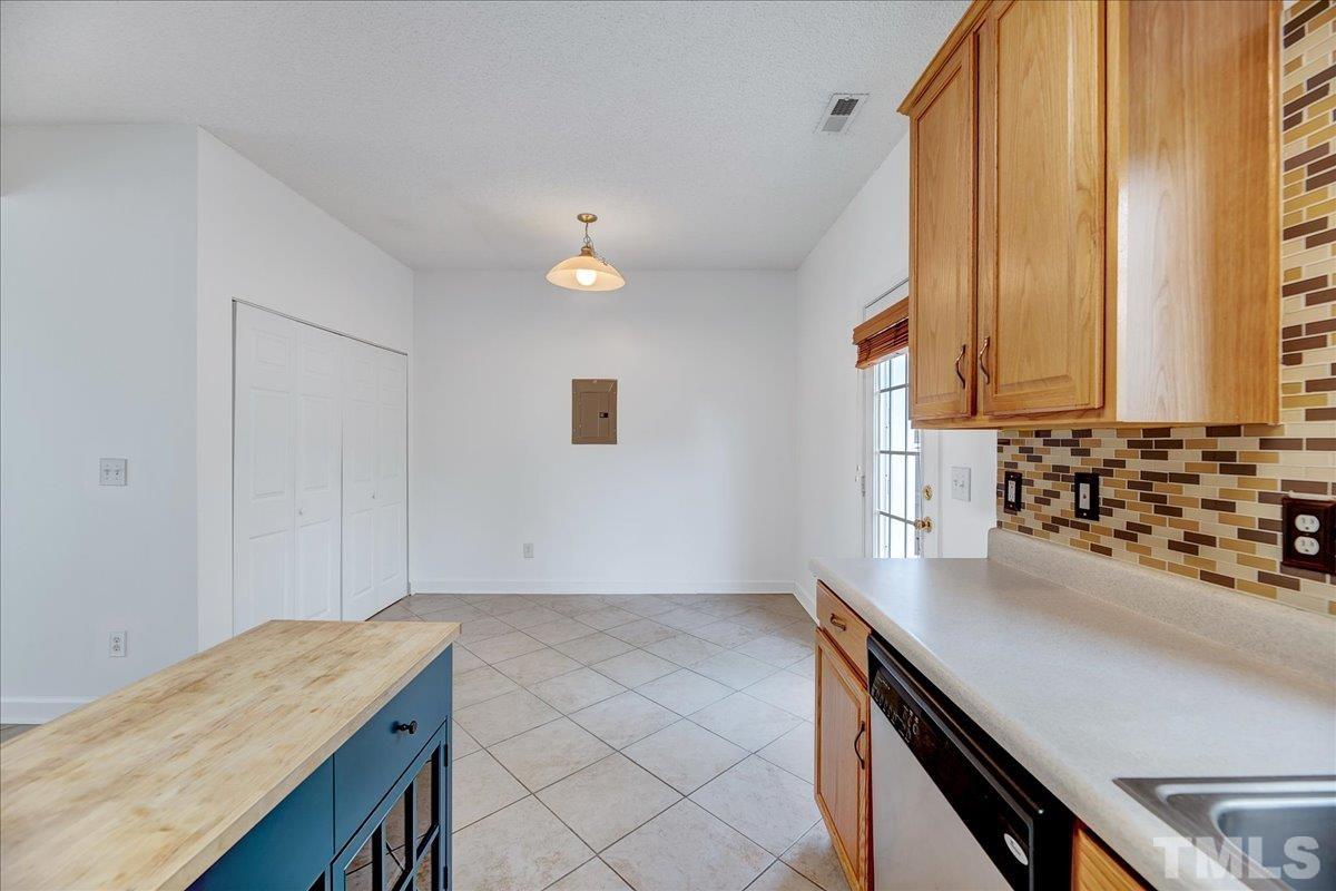 3367 Bridgeville Road Raleigh, NC 27610 - Photo 14 of 34 a kitchen with a sink a stove and cabinets