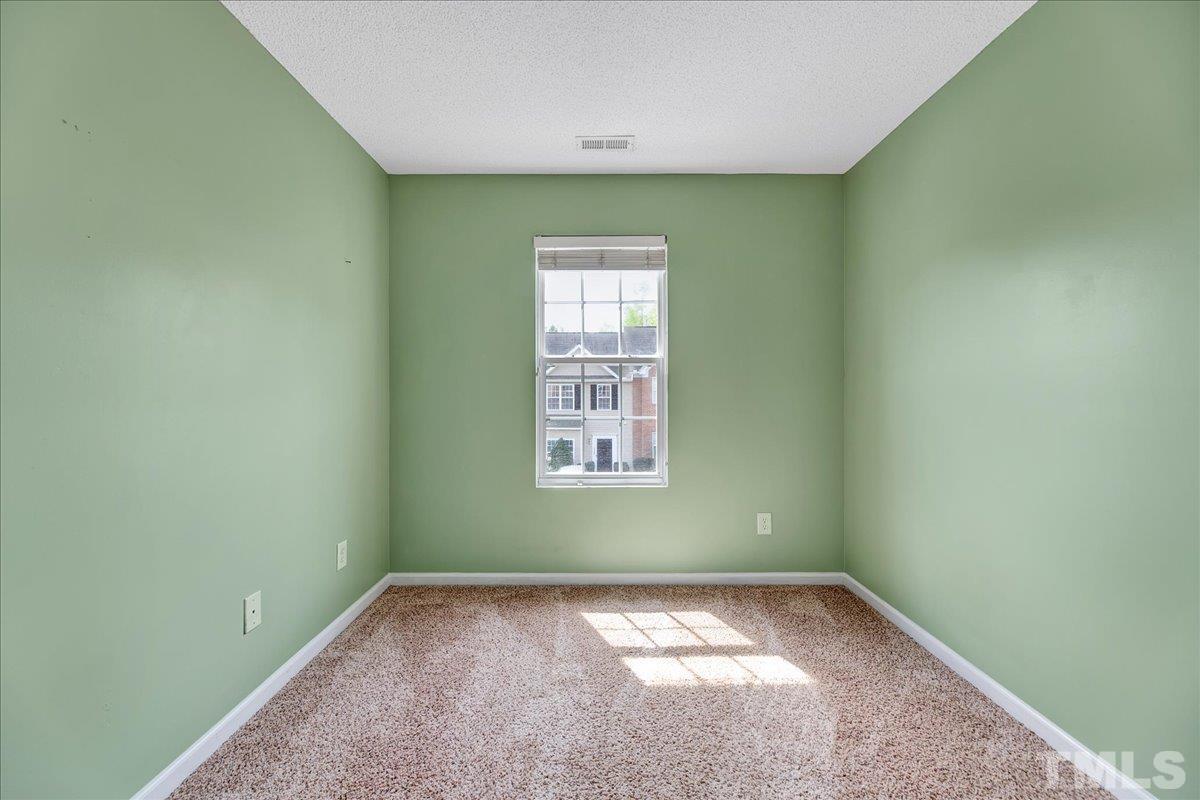 3367 Bridgeville Road Raleigh, NC 27610 - Photo 18 of 34 a view of a room that has a window in it