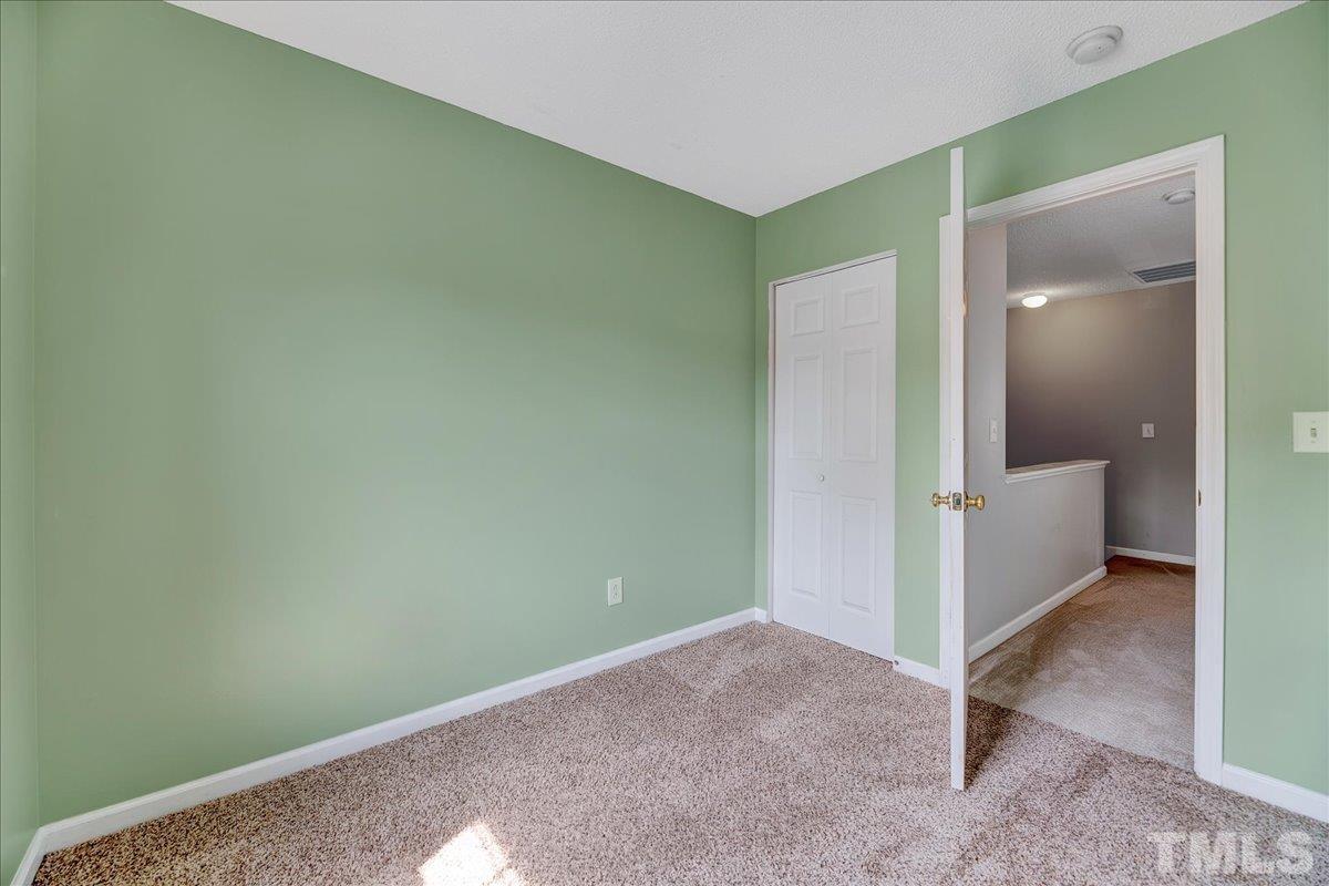 3367 Bridgeville Road Raleigh, NC 27610 - Photo 19 of 34 an empty room with mirror