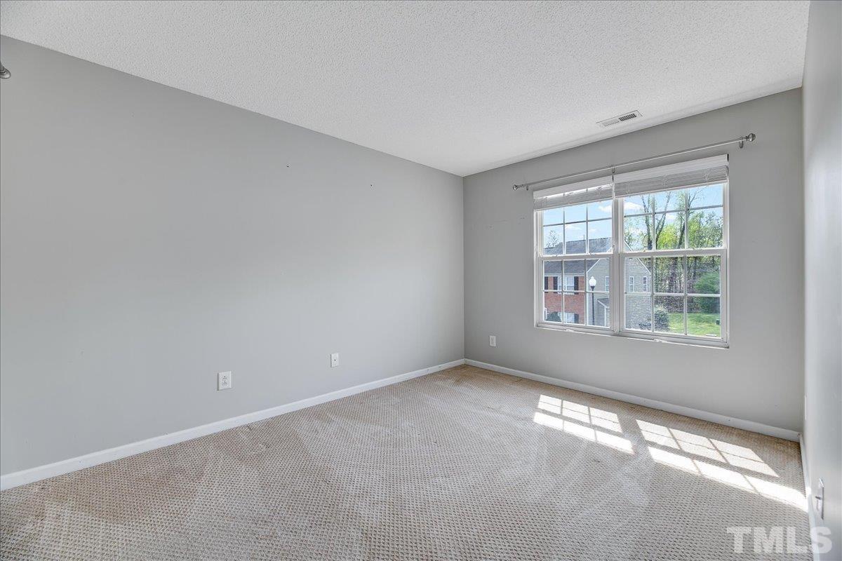 3367 Bridgeville Road Raleigh, NC 27610 - Photo 21 of 34 a view of an empty room with a window