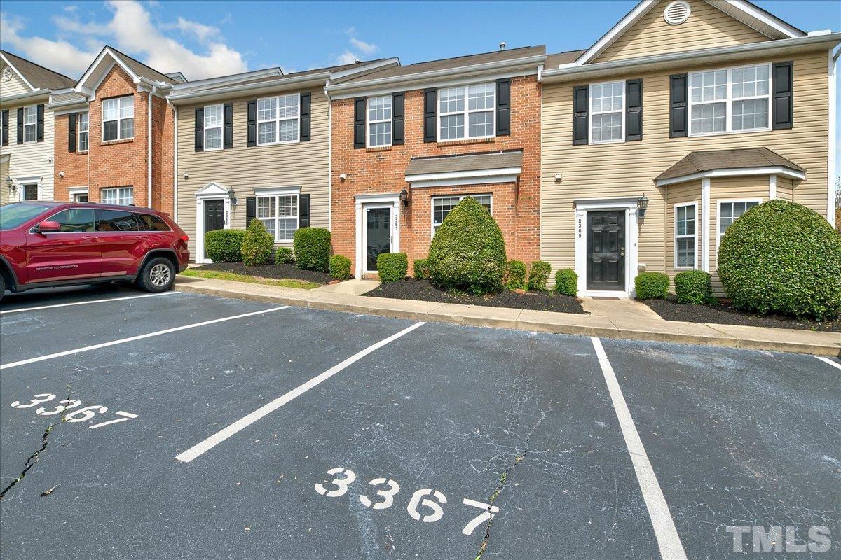 3367 Bridgeville Road Raleigh, NC 27610 - Photo 3 of 34 a couple of cars parked in front of a building