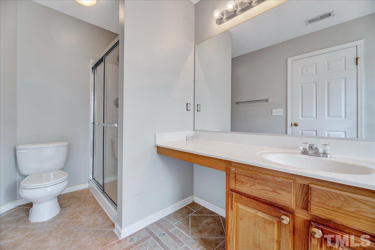 3367 Bridgeville Road Raleigh, NC 27610 - Photo 31 of 34 a bathroom with a sink and a toilet