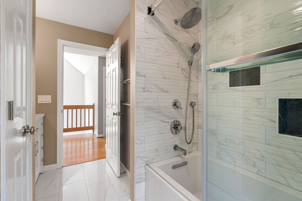 11 Black Elk Road Sharon, MA 02067 - Photo 21 of 28 a bathroom with a bathtub and a shower