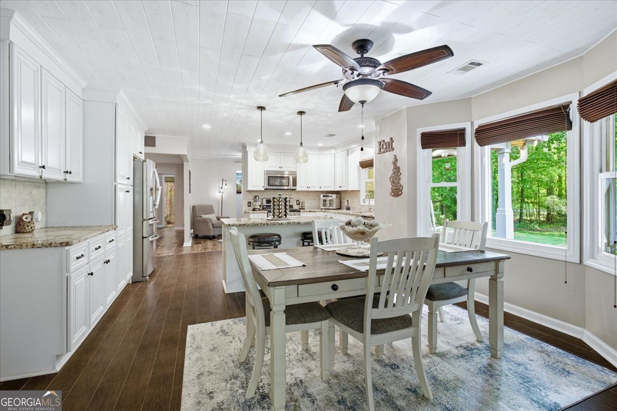 265 Floyd Road Hampton, GA 30228 - Photo 16 of 64 a view of a dining room with furniture window and outside view