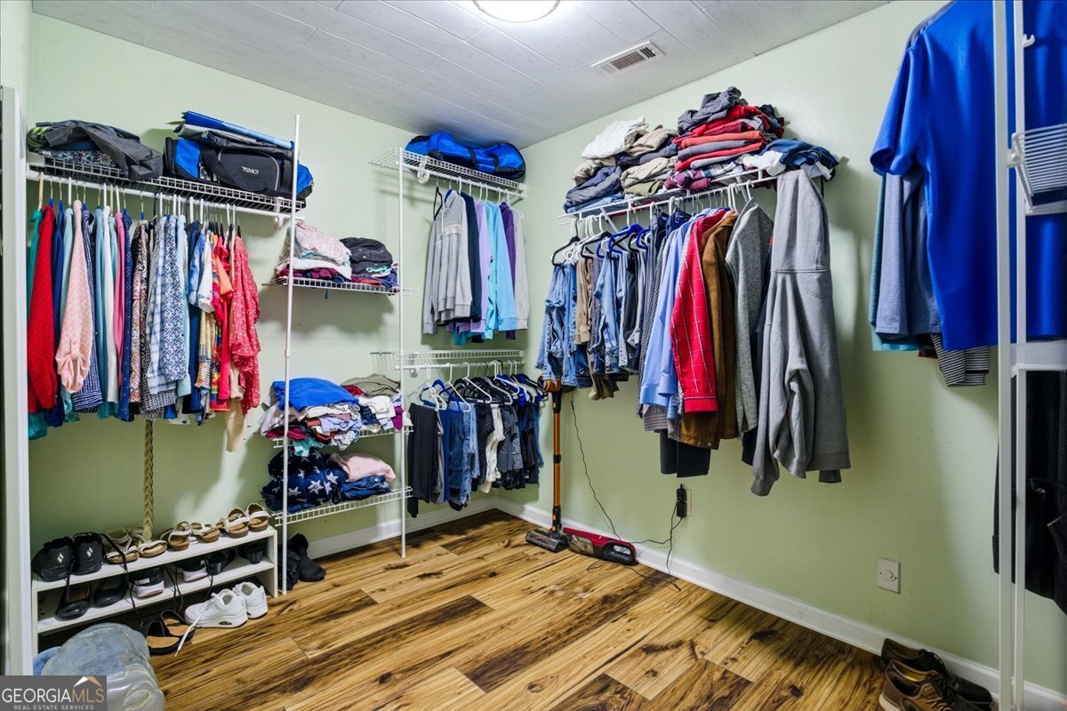 265 Floyd Road Hampton, GA 30228 - Photo 21 of 64 a view of walk in closet with clothes
