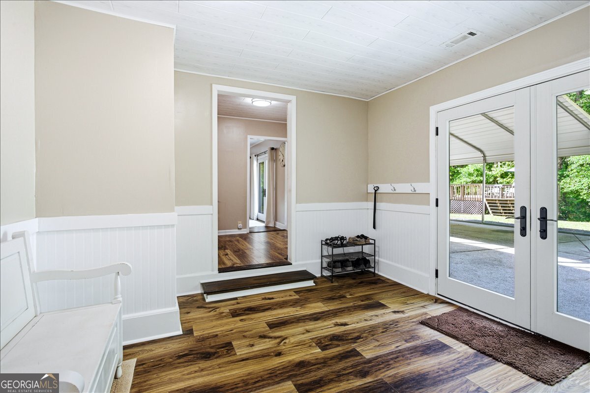 265 Floyd Road Hampton, GA 30228 - Photo 24 of 64 a bedroom with a bed and wooden floor