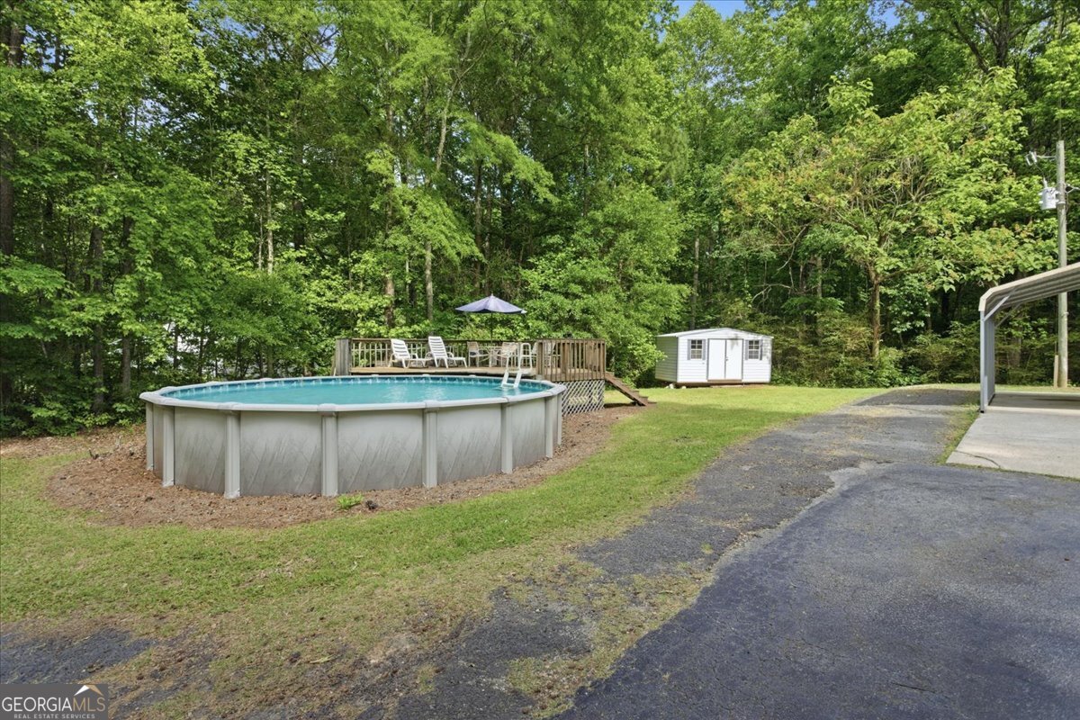 265 Floyd Road Hampton, GA 30228 - Photo 36 of 64 a view of a backyard with large trees