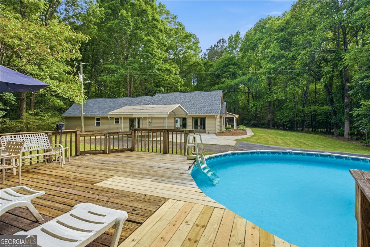 265 Floyd Road Hampton, GA 30228 - Photo 38 of 64 a front view of a house with swimming pool