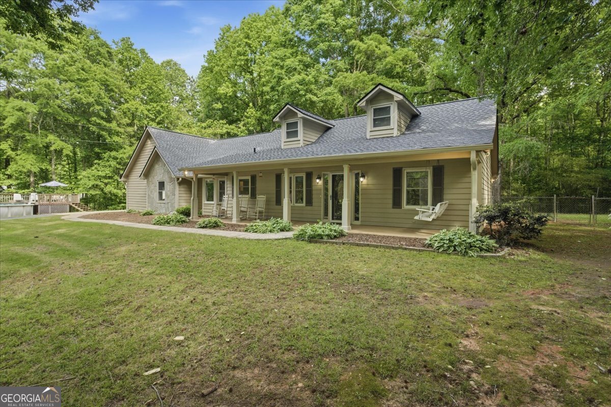 265 Floyd Road Hampton, GA 30228 - Photo 40 of 64 a front view of a house with garden