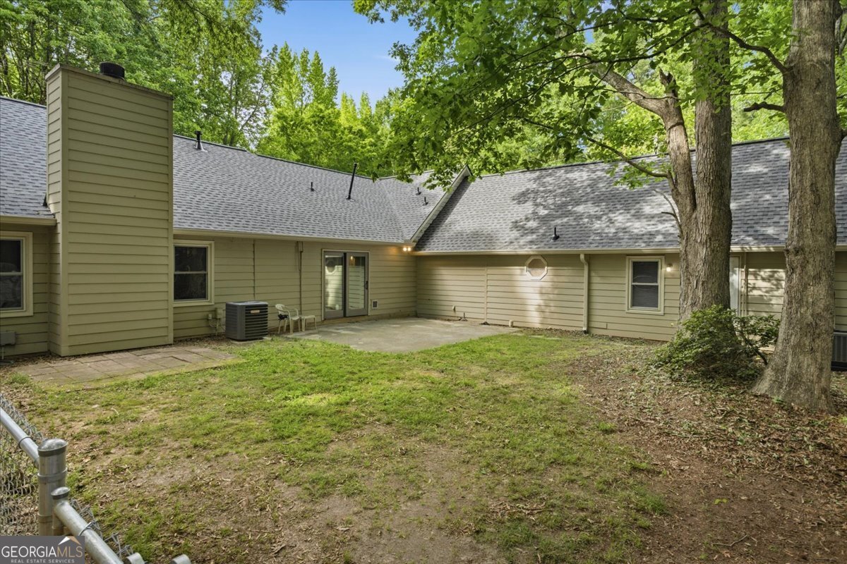 265 Floyd Road Hampton, GA 30228 - Photo 46 of 64 a front view of a house with a garden