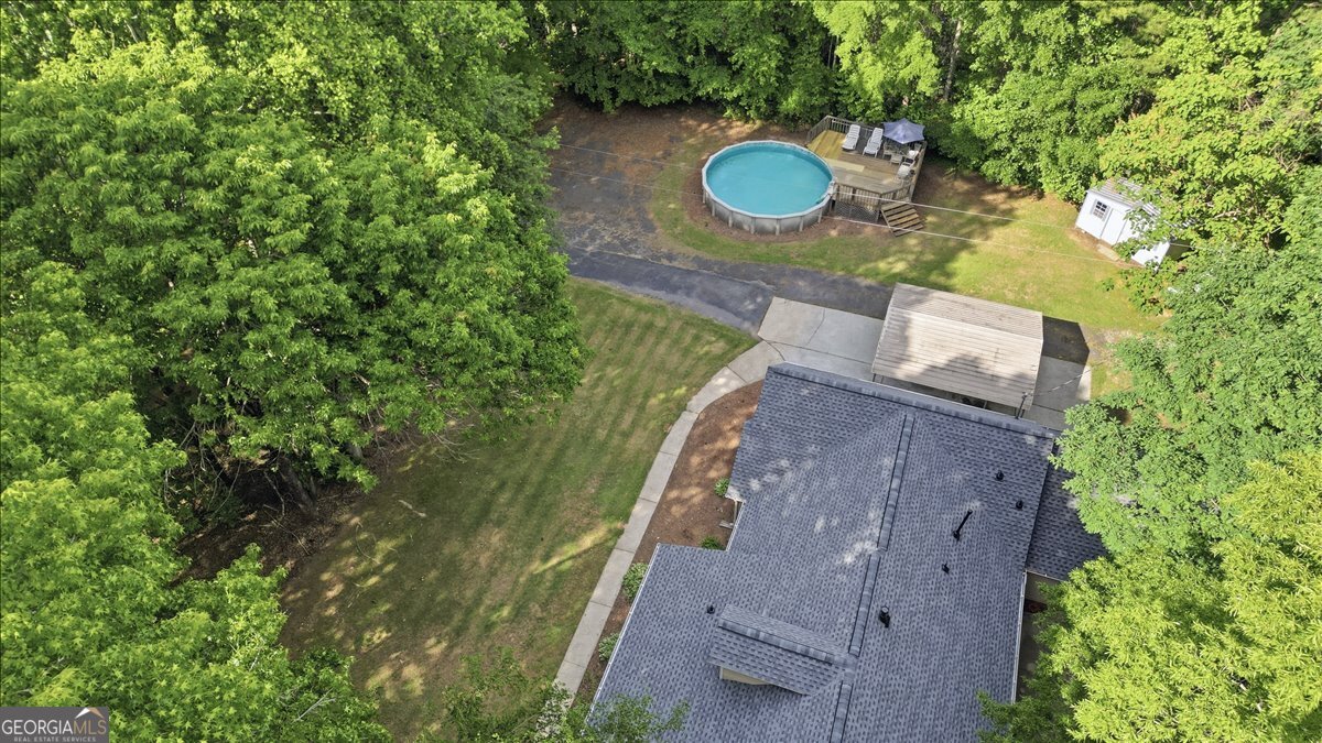 265 Floyd Road Hampton, GA 30228 - Photo 54 of 64 a aerial view of a house with a yard and a wooden fence