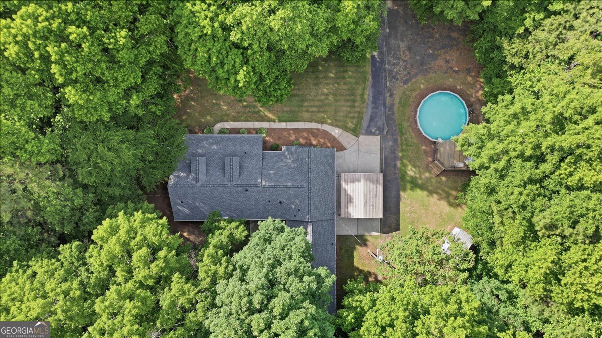 265 Floyd Road Hampton, GA 30228 - Photo 55 of 64 an aerial view of a house with garden space and street view