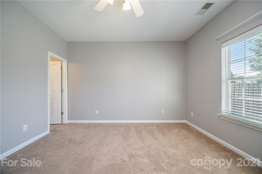 141 Rhyne Springs Road Mount Holly, NC 28120 - Photo 12 of 17 a view of an empty room with a window