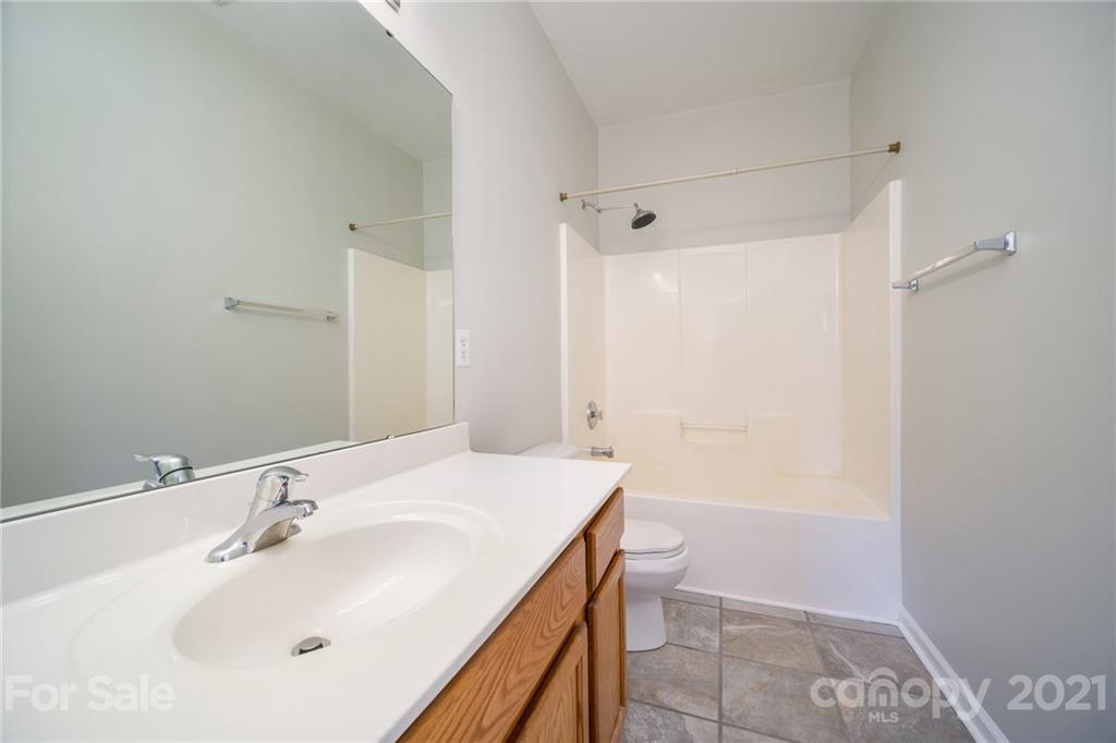 141 Rhyne Springs Road Mount Holly, NC 28120 - Photo 13 of 17 a bathroom with a sink and a mirror