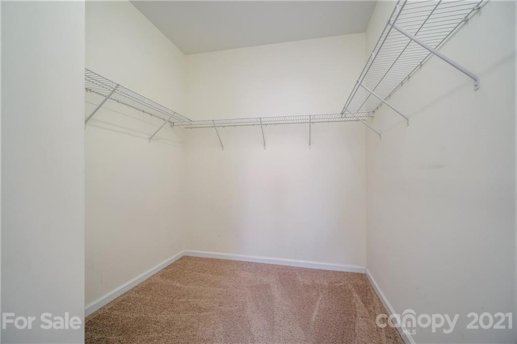 141 Rhyne Springs Road Mount Holly, NC 28120 - Photo 14 of 17 a view of a room with racks on the wall