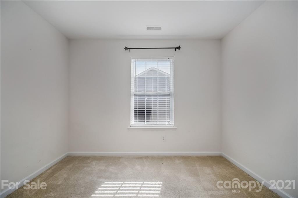141 Rhyne Springs Road Mount Holly, NC 28120 - Photo 15 of 17 a view of an empty room with a window